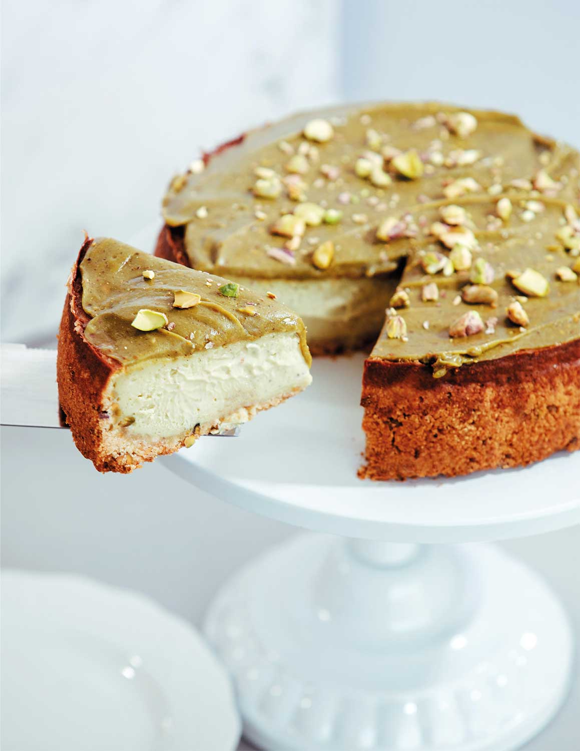 Fotografía de un cheesecake de pistacho